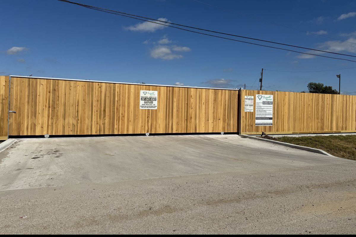 Fenced vehicle pickup yard at 1320 W Tyler St, La Porte